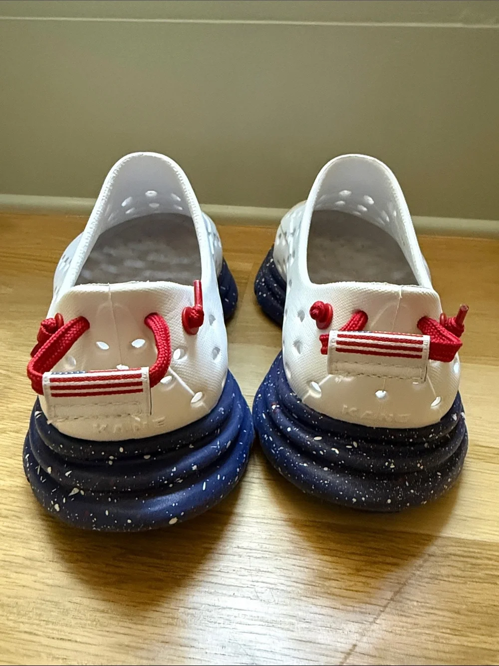 Men’s Kane shoes white with blue bottom and white and red speckles